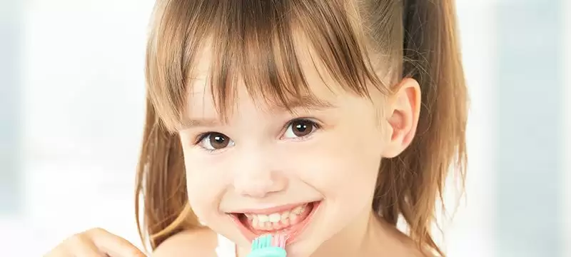 Child brushing teeth